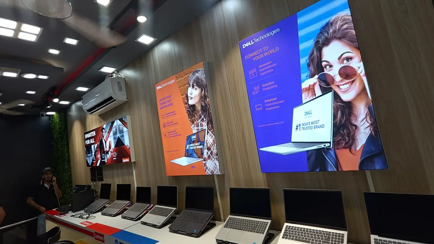 Digital communication screens and laptop display wall at Arrow Abroad