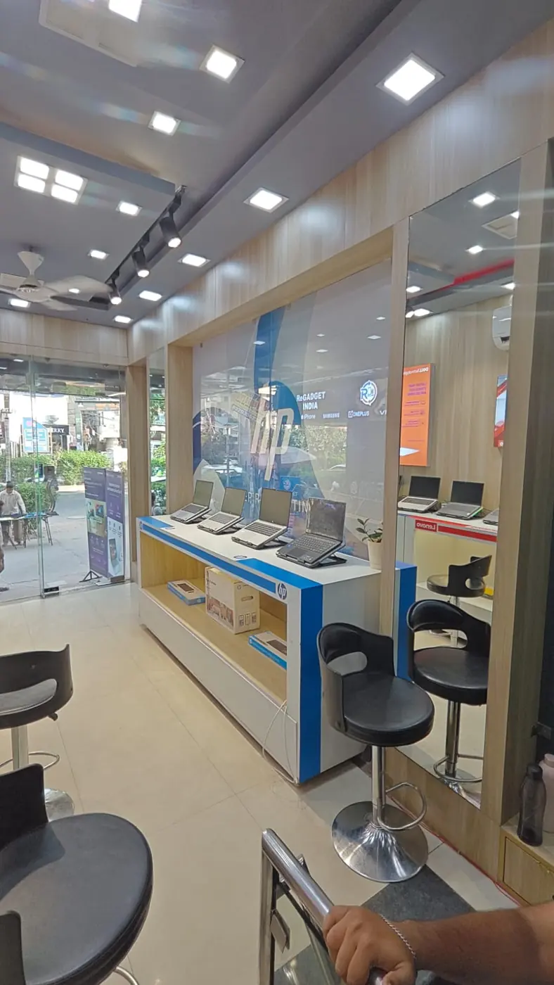 Product display fixtures and customer seating near the store entrance