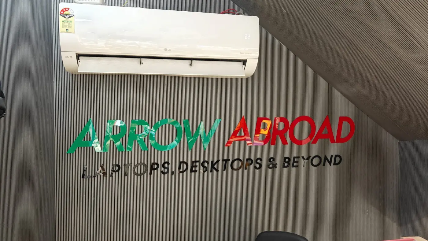 Fabricated Arrow Abroad logo signage on the finished feature wall