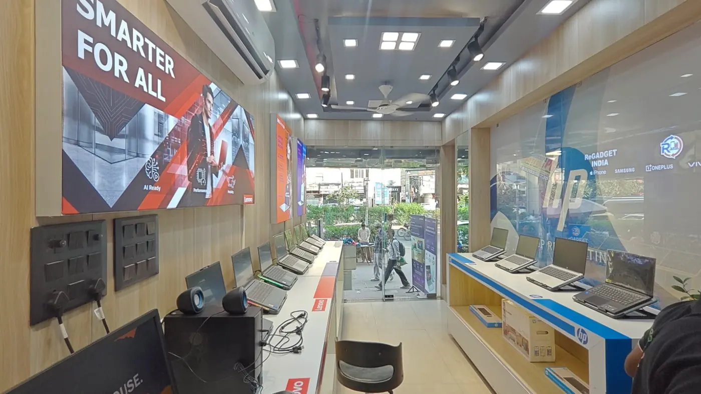 Completed Arrow Abroad retail floor with laptop display wall